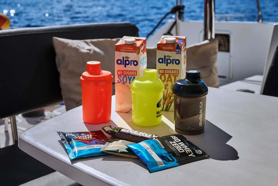 Agios Nikolaos All-inclusive Catamaran Cruise & Water Toys - Passing the Cave of Barbarossa near Elounda