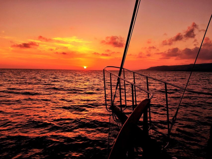 Argostoli: Sunset Cruise with Swim Stops, Dinner, and Wine - Vardiani and the Rabbit Islands Photo Stop: Short, Scenic, and Sets the Tone