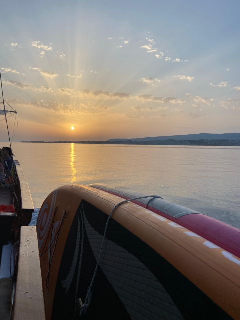 Argostoli: Sunset Cruise with Swim Stops, Dinner, and Wine - Dinner on Deck at Sunset: Moussaka, Salad, Wine, and a Boat-Dinner Rhythm