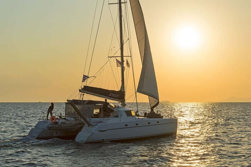 Athens: Half-Day Sunset Catamaran Cruise with Meal & Drinks - Sunset views over Athens coastline, without the stress