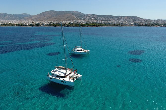 Athens Private Luxury Catamaran Cruise with Traditional Greek Meal and BBQ - First Steps Onboard: Pickup, Welcome Drink, and a Real Safety Briefing