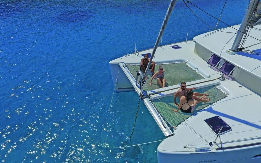 Athens: Riviera Catamaran Cruise with Meal and Drinks - Onboard vibes: welcome drinks, safety, and the crew that keeps it moving
