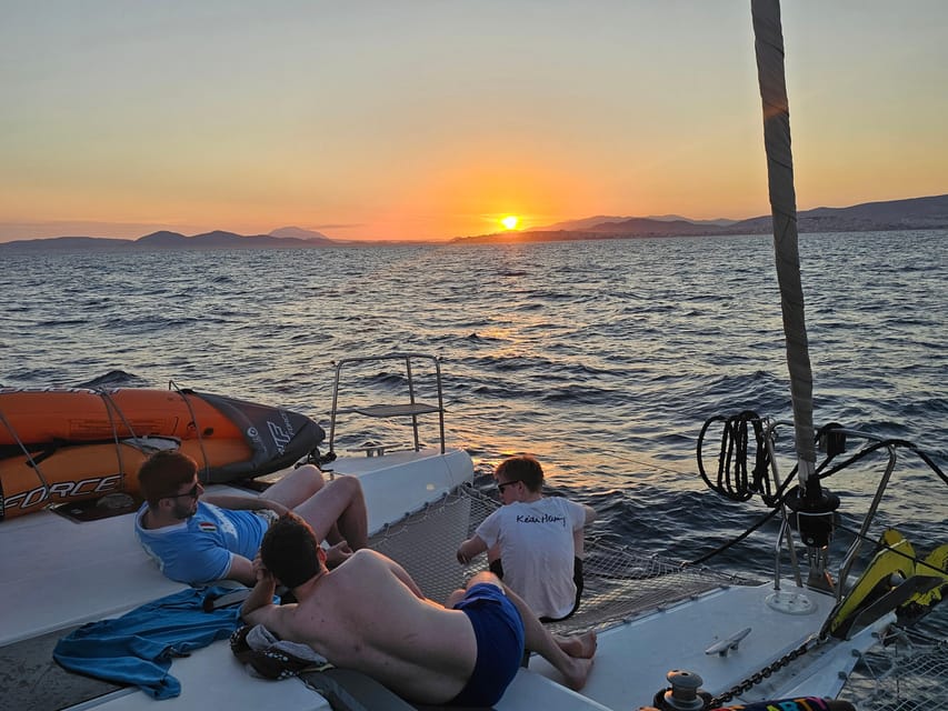 Athens: Riviera Catamaran Tour with Fresh Meal and Drinks - The onboard 7-dish meal, cooked as you cruise