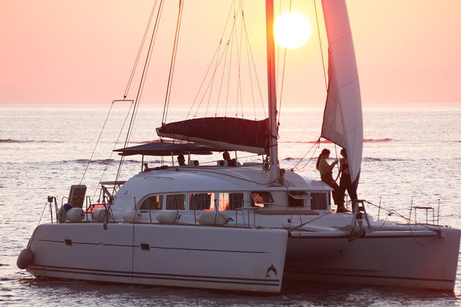 Catamaran Day & Sunset Cruises with meals Drinks and transportation - Onboard meal and drinks: seafood pasta, meat options, and unlimited homemade rose wine