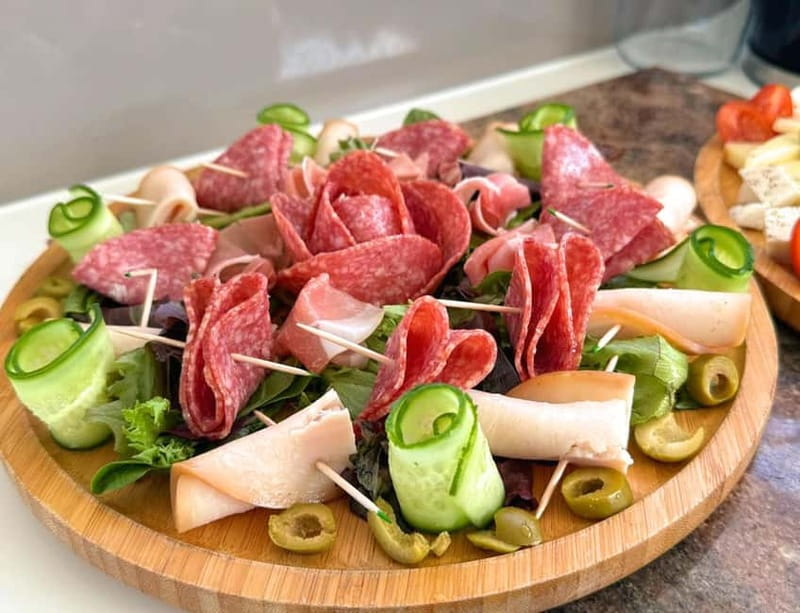 Chania Old Port:Luxury Sunset Catamaran Cruise with Prosecco - The food and drink setup: Prosecco, sushi rolls, fruit, and an actual open bar