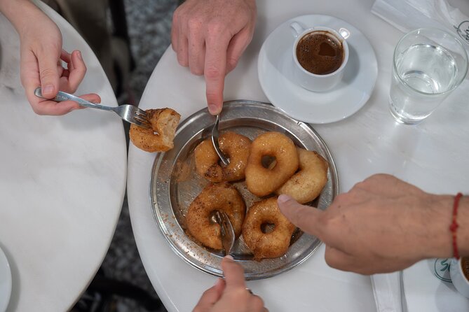 Classic Athens Food Tour with Local Drink & Market Visit - Spirits and regional food at the restaurant: the near-meal moment