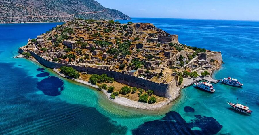 Crete: Spinalonga, Elounda, & Agios Nikolaos Boat Tour & BBQ - From Heraklion to Elounda, with Mirabello Bay already in view