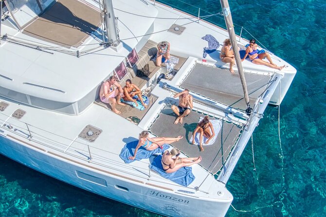 Deluxe Santorini Sailing with BBQ and Drinks Shared Tour - Onboard Setup: BBQ, Unlimited Drinks, and Snorkel Gear