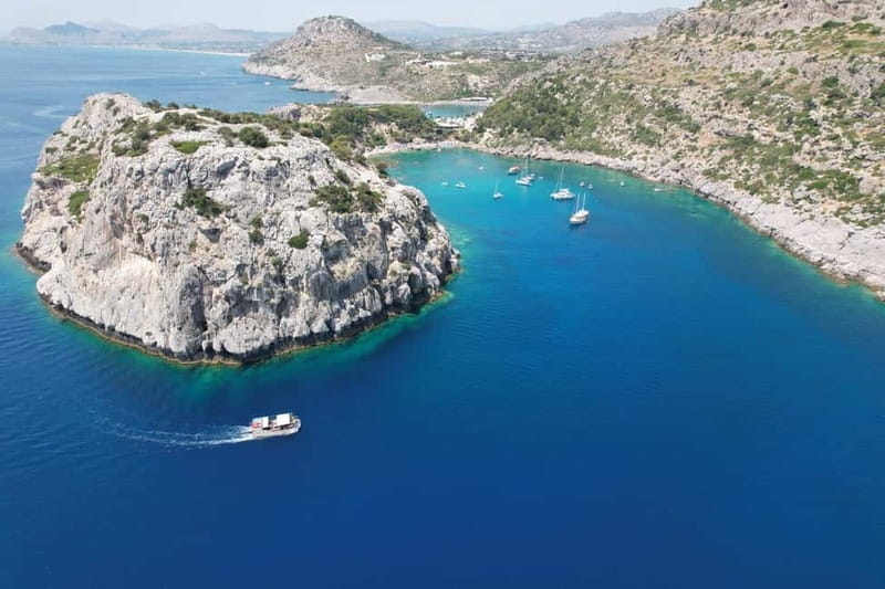 Faliraki: Boat Trip to Anthony Quinn & The Caves with Drinks - Meeting at Faliraki Beach, from red steps to the yellow boat