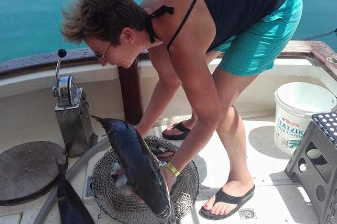 Fishing Boat Trip with Professional Fisherman (Small Group) - Switching gears: swimming time and photos with the catch