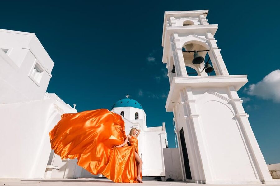 Flying dress Photoshoot in Santorini with Hotel Pickup - Imerovigli photo session: blue domes, caldera views, and white walls