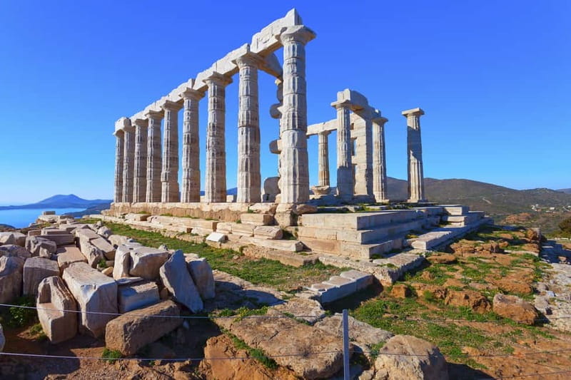 From Athens: Temple of Poseidon & Cape Sounion Half-Day Tour - Arriving at Cape Sounion: cliffs, sea air, and an hour to explore