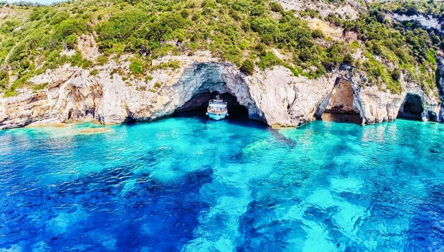From Corfu: Day Cruise to Paxos, Antipaxos, and Blue Caves - Sailing through the Paxos channel: Panagia and Agios Nikolaos views