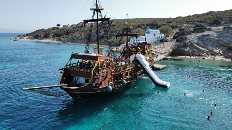 From Kos: 3-Island Pirate Cruise with Lunch and Waterslide - Atmosphere on deck: lively crew, but expect loud music
