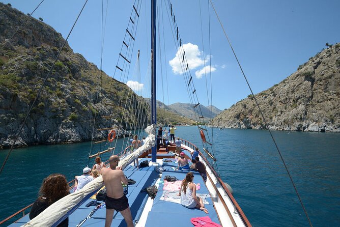 Full Day 3-Island Boat Cruise from Port of Kos - Vathi on Kalymnos: fjord entry, sweets, and sponge-warehouse streets