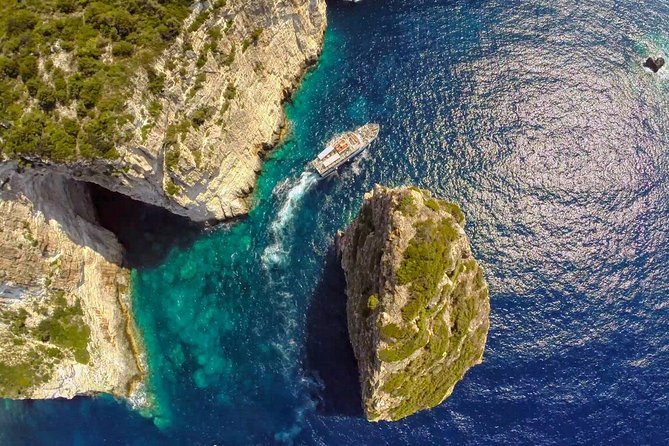 Full-Day Boat Tour of Paxos Antipaxos Blue Caves from Corfu - Erimitis cliffs, Ortolithos island, and Tripitos (Kamara)