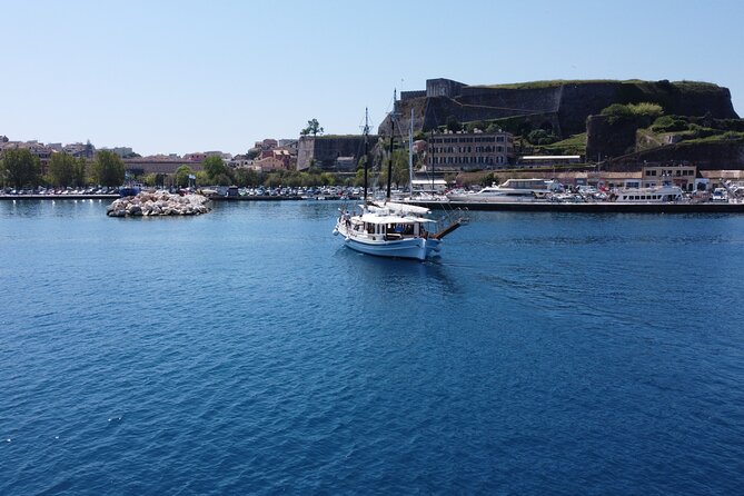 Full Day Cruise from Corfu in Classic Wooden Vessel, Swim & BBQ - Peristeres Lighthouse in 10 minutes: British-era maritime views