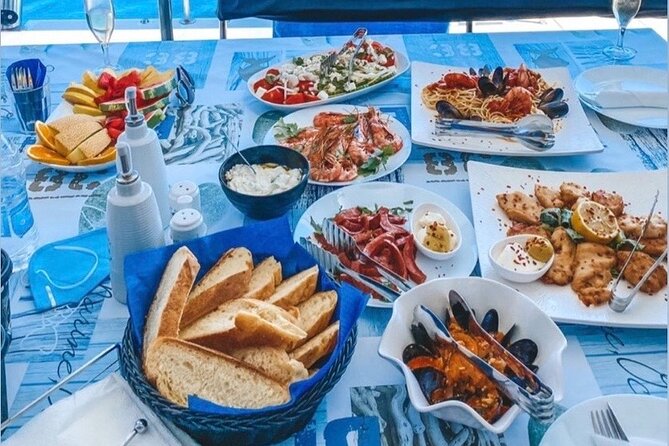 Half-Day Exclusive Catamaran Cruise in Santorini with Meal and Open Bar - Santorini volcano hot springs: warm water, quick swim time