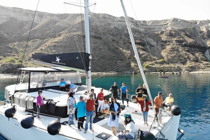 Half-Day Exclusive Catamaran Cruise in Santorini with Meal and Open Bar - Sailing back with caldera views: Old Port of Fira, Indian Rock, Black Mountain