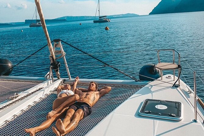 Half Day Premium Catamaran Cruise in Santorini including Oia - Thirassia caldera views, snorkeling time, and on-board BBQ
