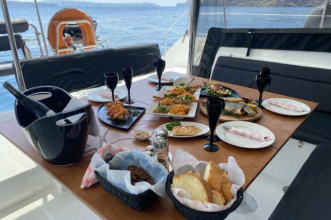 Half Day Premium Catamaran Cruise in Santorini including Oia - Oia from the water, plus Ammoudi and the lighthouse sail-by