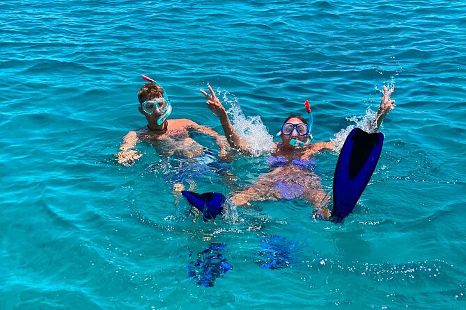 Heraklion: Catamaran Cruise to Dia with Sunset, Meal & Bar - Dia Bay water time: slides, sea scooter, snorkel, SUP, kayak