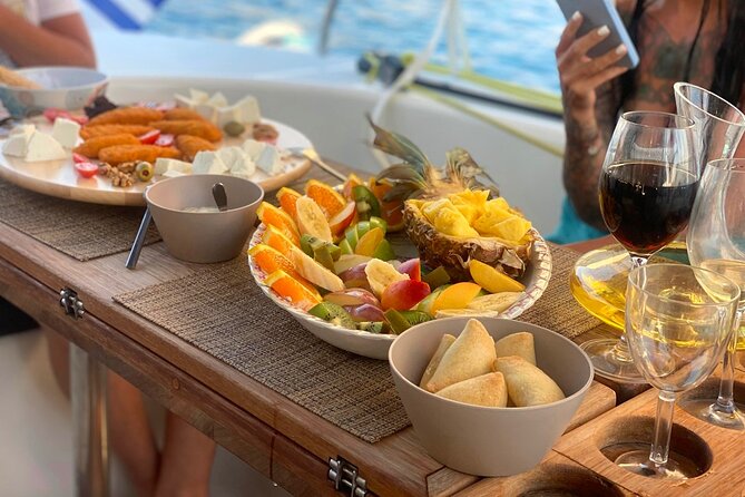 Hersonissos: Luxury Sunset Catamaran Cruise Sushi & Open Bar - Saint George Bay: the swim stop, chapel vibes, and sunset timing