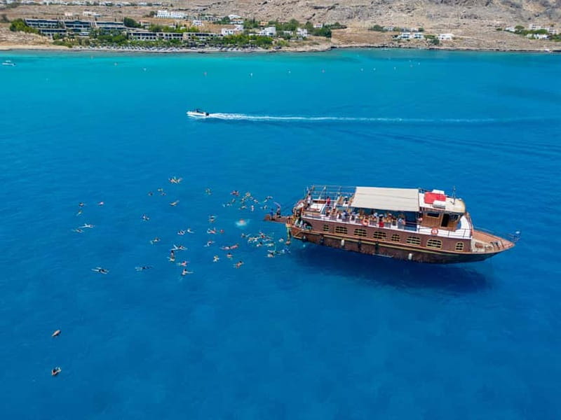 Kolympia : Transfer & Cruise to Lindos with 3 Swimming Stops - Arriving in Lindos: 2.5 hours to explore the town and choose your Acropolis plan