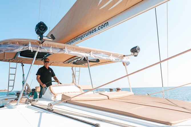 Luxury Santorini Catamaran Cruise: Lunch, BBQ, Drinks, Transfers - The sailing route that sets the mood: Red Beach, White Beach, and Akrotiri Lighthouse