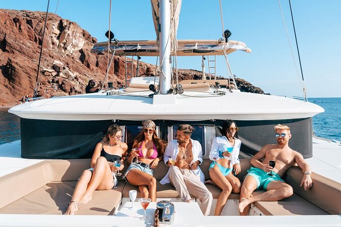 Luxury Santorini Catamaran Cruise: Lunch, BBQ, Drinks, Transfers - Mesa Pigadia Beach: your first real swim and snorkel break