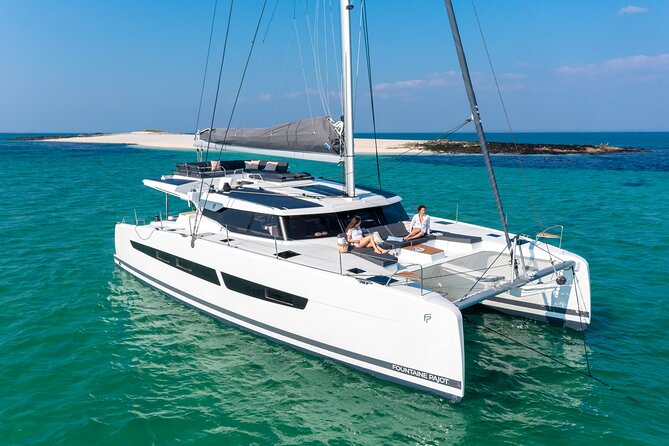 Mykonos: Brand-New Catamaran Cruise with Meal, Drinks & Transport - Cruising Mykonos From the Water, Without the Usual Chaos