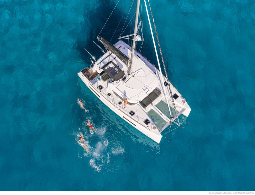 Mykonos: Catamaran Cruise with Lunch, Drinks and Transfer - From Mathios Tavern to the catamaran: getting comfortable fast