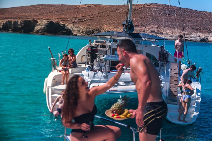 Mykonos: Catamaran Cruise with Lunch, Drinks and Transfer - Lunch on deck: seafood pasta, meat and vegetarian options, plus rosé