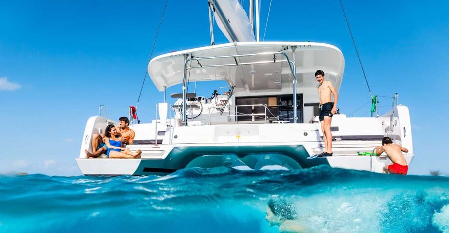 Mykonos: Catamaran Cruise with Lunch, Drinks and Transfer - Sailing back past Mykonos windmills: views, aperitif, and optional sunset