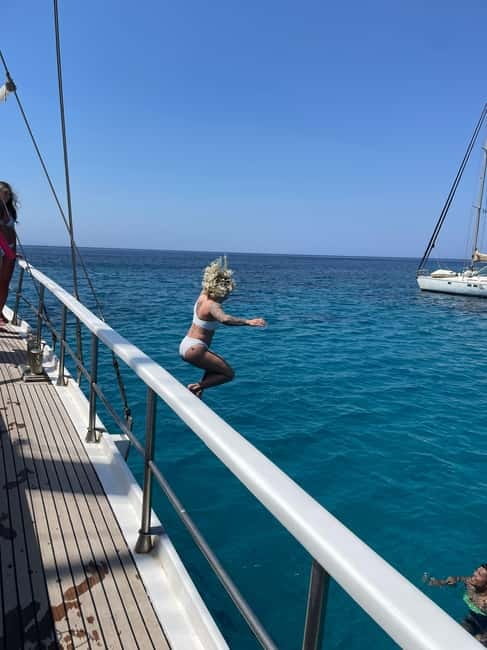 Mykonos: Delos and Rhenia Islands Cruise with BBQ Meal - Rheneia: swimming, snorkeling, and a relaxed island rhythm
