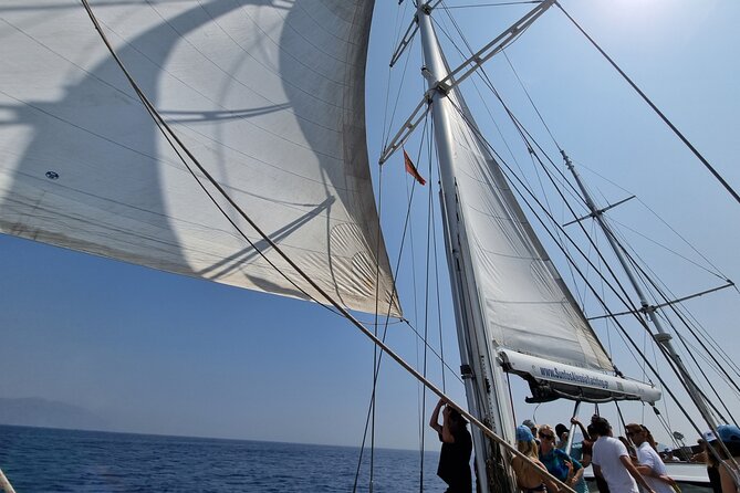 Mykonos Sail Cruise to Rhenia, Guided Tour of Delos, Lunch&Drinks - Delos with a licensed English guide, temples, museum, and Mt. Kythnos views