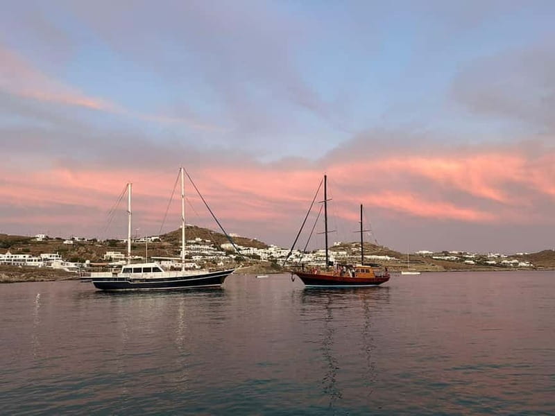 Mykonos: Sunset Boat Cruise with Light Dinner & Drinks - The onboard dinner: fresh fish, BBQ energy, and plenty of drinks