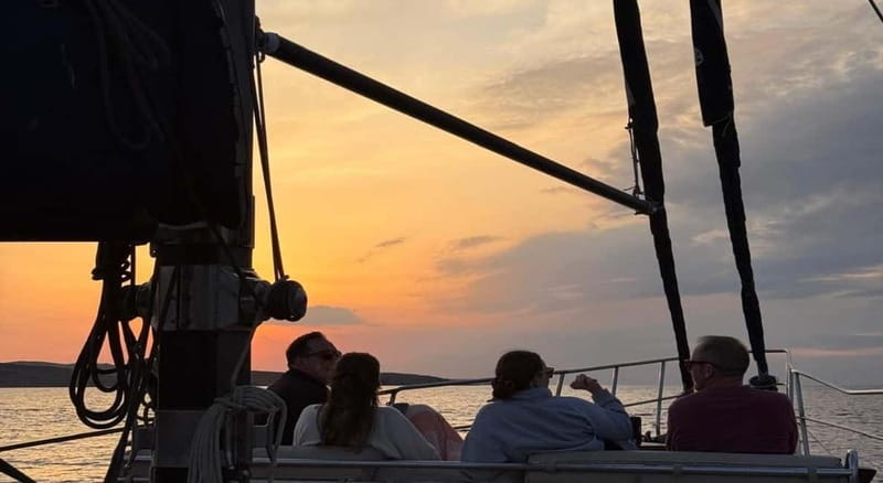 Mykonos: Sunset Boat Cruise with Light Dinner & Drinks - The bay-hopping sail: Ornos, Psarou, and Platis Gialos