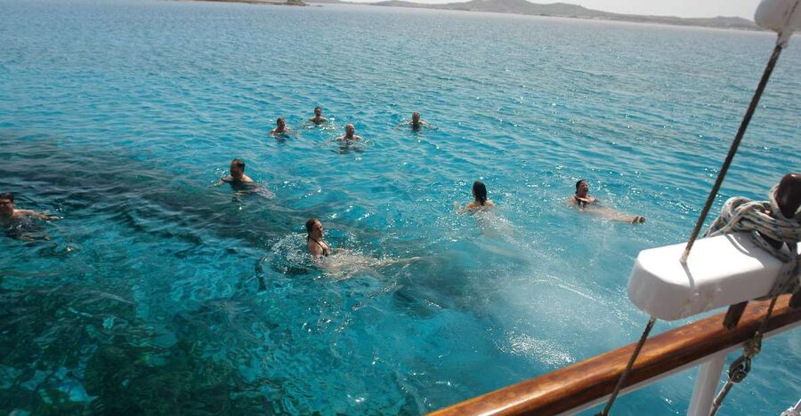 Mykonos: Sunset Party Boat Cruise with 1 Drink - Old Port Check-In at 5:30 PM, Then Off on a Wooden Party Boat