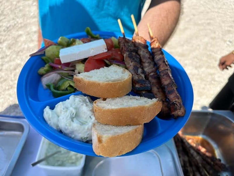 Nydri: Island Hopping Boat Cruise with Beach BBQ Lunch - Cruising Meganisi Island views from the water