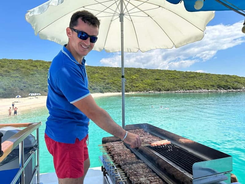 Nydri: Island Hopping Boat Cruise with Beach BBQ Lunch - Onassis Island stories at Skorpios, plus one more swim