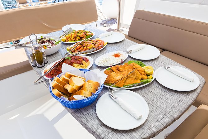 Premium Small-Group Catamaran Cruise with BBQ, Open Bar, Transfer - Red Beach and White Beach: Mineral Color, Big Views, Zero Drop-Off