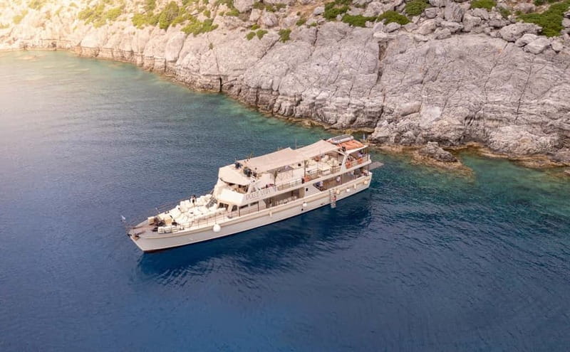 Rhodes: Beach Gem Exploration Cruise with Lunch & Transfer - The boat and the vibe: seating zones plus DJ energy