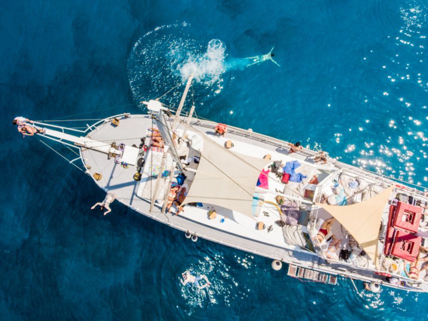 Rhodes: Boat Tour with Snorkeling, Gourmet Buffet & Open Bar - Sailing to Afandou: snacks and the slower pace between swims
