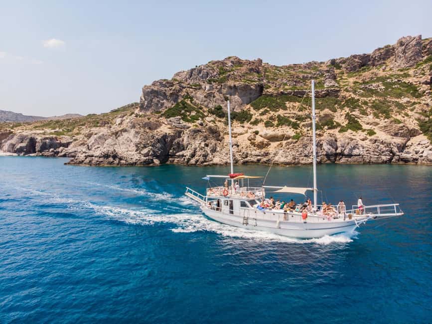 Rhodes: Boat Tour with Snorkeling, Gourmet Buffet & Open Bar - Anthony Quinn Bay: cocktails with Greek spirits and time to linger