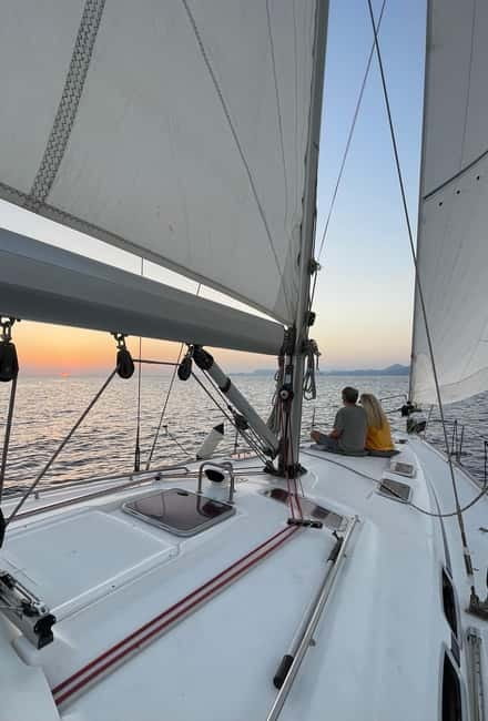 Rhodes: Sunset Catamaran Cruise with Snack, Fruits & Drinks - Setting Sail from Mandraki Marina, Built for Sunset Light