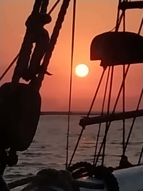 Rhodes: Sunset Cruise 1 hour on an 18th-Century Boat - Mandraki Harbor departure: windmills, fishing boats, and that first glow