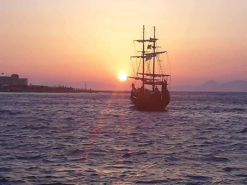 Rhodes: Sunset Cruise 1 hour on an 18th-Century Boat - Ancient Harbor views: medieval walls and the city after dark