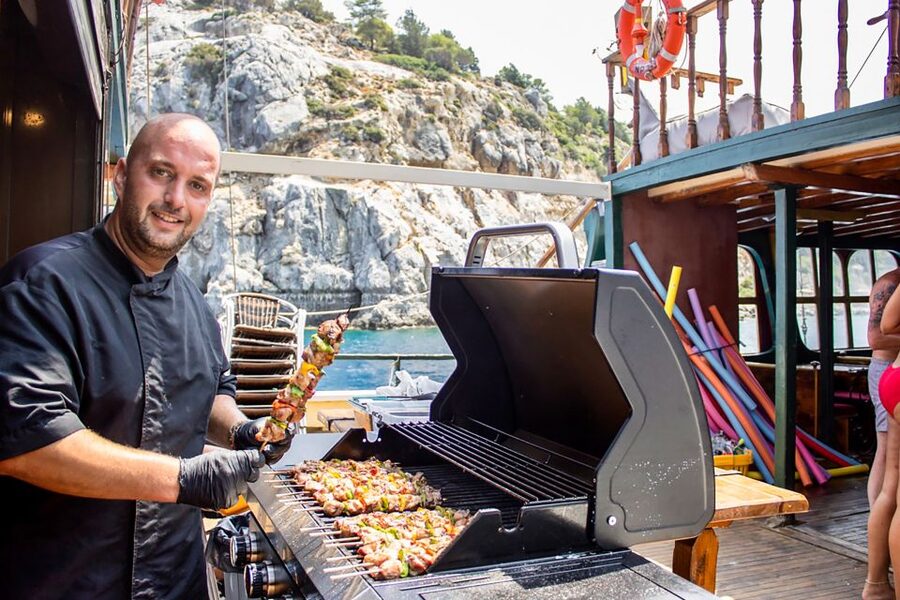 Rhodes: Sunset Cruise with Greek BBQ and Unlimited Drinks - Greek BBQ on the Water: How the Meal Fits the Evening