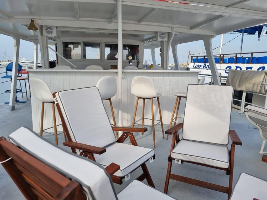 Rhodes: Sunset Cruise with Live Music, Wine & Greek Buffet - Mandraki Port Boarding: Find Romantika Dreams fast